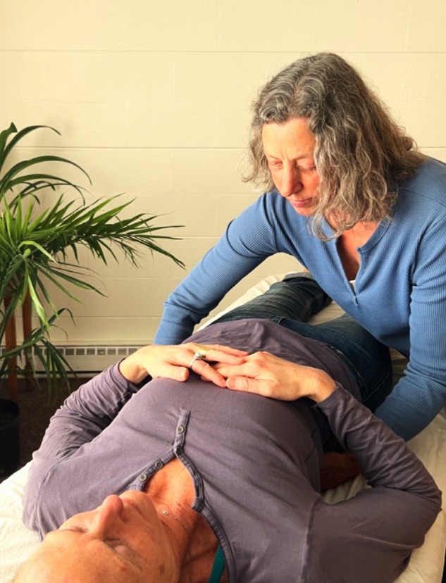 Photo of a Zero Balancing Demonstration, including the face of Jenny Chapin